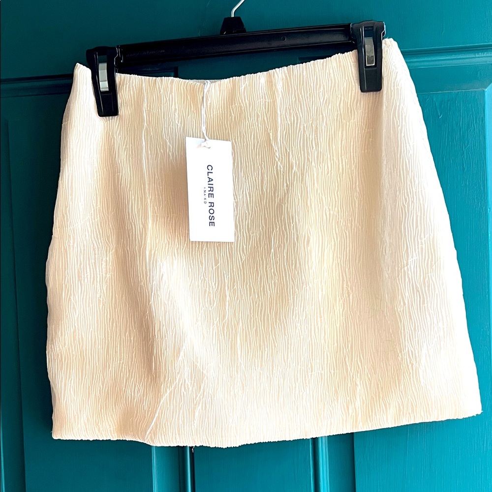 Claire Rose Cream Mini Skirt. Off white
